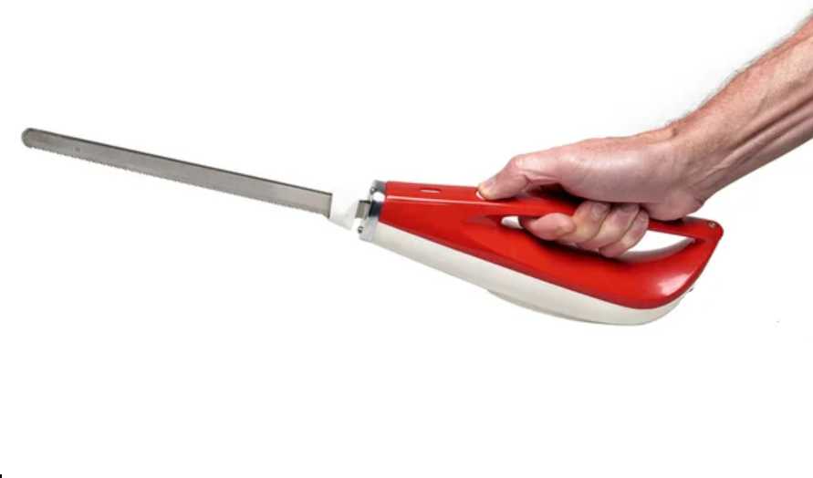 a hand holding a cordless electric knife