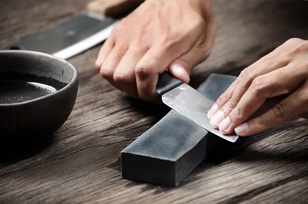 a japanese knife getting sharpened