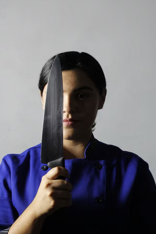 a woman with a large knife
